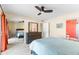 Bright bedroom with a ceiling fan and ample closet space at 530 E Calavar Rd, Phoenix, AZ 85022