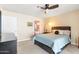 Spacious bedroom with ceiling fan and mirrored closet doors at 530 E Calavar Rd, Phoenix, AZ 85022