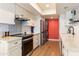 Modern kitchen with stainless steel appliances and white cabinets at 530 E Calavar Rd, Phoenix, AZ 85022