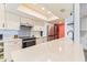 Modern kitchen with white shaker cabinets, quartz counters, and a gas range at 530 E Calavar Rd, Phoenix, AZ 85022