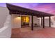 Private patio with covered pergola and comfortable seating at 530 E Calavar Rd, Phoenix, AZ 85022