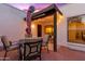 Brick patio with seating area, covered pergola, and string lights at 530 E Calavar Rd, Phoenix, AZ 85022