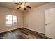 Well-lit bedroom with wood-look floors and a window at 5450 E Deer Valley Dr # 1204, Phoenix, AZ 85054