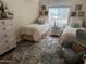 Cozy bedroom with twin beds, rug, and ample closet space at 5450 E Deer Valley Dr # 1204, Phoenix, AZ 85054