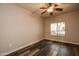 Simple bedroom with wood-look floors and large window at 5450 E Deer Valley Dr # 1204, Phoenix, AZ 85054