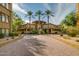 Building exterior with palm trees at 5450 E Deer Valley Dr # 1204, Phoenix, AZ 85054