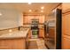 Kitchen boasts stainless steel appliances and wood cabinets at 5450 E Deer Valley Dr # 1204, Phoenix, AZ 85054