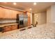 Kitchen with granite countertops and stainless steel fridge at 5450 E Deer Valley Dr # 1204, Phoenix, AZ 85054