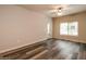 Living room with patio door and wood-look flooring at 5450 E Deer Valley Dr # 1204, Phoenix, AZ 85054