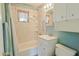 Clean bathroom with tub, shower, vanity, and storage at 6016 N 36Th Dr, Phoenix, AZ 85019