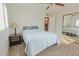 Bright bedroom with double bed, nightstand and mirrored closet at 6016 N 36Th Dr, Phoenix, AZ 85019