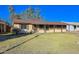 Ranch-style home with a well-maintained lawn and driveway at 6016 N 36Th Dr, Phoenix, AZ 85019