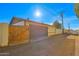 Detached garage with wooden gate and large door at 6016 N 36Th Dr, Phoenix, AZ 85019