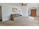 Living room with a couch, carpet, and built-in shelving at 6016 N 36Th Dr, Phoenix, AZ 85019