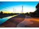 Evening view of a canal-side paved pathway, ideal for walking or biking at 6415 S El Camino Dr, Tempe, AZ 85283