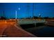 Night view of a canal path with bridge and modern light post at 6415 S El Camino Dr, Tempe, AZ 85283