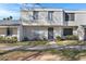 Two-story condo with light-colored siding, a walkway, and landscaping at 6415 S El Camino Dr, Tempe, AZ 85283