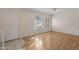 Living room with laminate wood flooring and neutral walls at 6415 S El Camino Dr, Tempe, AZ 85283