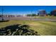 Scenic Tempe park with lush grass, paved pathways, and city skyline in background at 6415 S El Camino Dr, Tempe, AZ 85283