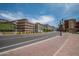 City street view, brick sidewalks, light rail and buildings at 6415 S El Camino Dr, Tempe, AZ 85283