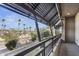 Private balcony overlooking palm trees and city at 6565 E Thomas Rd # 1141, Scottsdale, AZ 85251