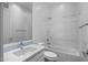 Modern bathroom with a shower/tub combo, white vanity, and tiled flooring at 6565 E Thomas Rd # 1141, Scottsdale, AZ 85251