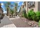 Landscaped walkway with gravel and brick pavers leading through the community at 6565 E Thomas Rd # 1141, Scottsdale, AZ 85251