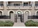 Townhouse entrance with a gated pathway and brick pavement at 6565 E Thomas Rd # 1141, Scottsdale, AZ 85251