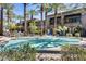 Community pool with surrounding landscaping at 6565 E Thomas Rd # 1141, Scottsdale, AZ 85251