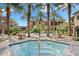 Community pool and spa with lounge chairs and patio furniture at 6565 E Thomas Rd # 1141, Scottsdale, AZ 85251