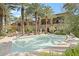 Community swimming pool with surrounding patio and lounge chairs at 6565 E Thomas Rd # 1141, Scottsdale, AZ 85251