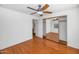 Bedroom with mirrored closet doors and wood floors at 6730 W Vernon Ave, Phoenix, AZ 85035