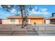 Ranch-style home with an attached garage and chain link fence at 6730 W Vernon Ave, Phoenix, AZ 85035