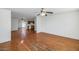 Hardwood floors and ceiling fans highlight this open living area at 6730 W Vernon Ave, Phoenix, AZ 85035