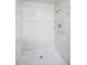 Clean shower with marble-style wall tile at 6730 W Vernon Ave, Phoenix, AZ 85035