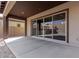 Covered patio with sliding glass doors leading to backyard at 7214 W Buckhorn Trl, Peoria, AZ 85383