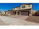 Two-story house on a residential street with landscaping and a three-car garage at 7214 W Buckhorn Trl, Peoria, AZ 85383