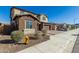 Two-story house on a residential street with landscaping and a three-car garage at 7214 W Buckhorn Trl, Peoria, AZ 85383