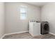 Laundry room with washer and dryer and grey flooring at 7214 W Buckhorn Trl, Peoria, AZ 85383