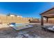 New home with a newly built pool in the backyard at 7214 W Buckhorn Trl, Peoria, AZ 85383