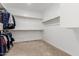 Large walk-in closet with ample shelving and hanging space at 7214 W Buckhorn Trl, Peoria, AZ 85383