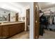 Elegant bathroom with double vanity and walk-in closet at 7737 E Columbine Way, Mesa, AZ 85208