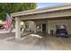 Home exterior featuring carport and golf cart at 7737 E Columbine Way, Mesa, AZ 85208