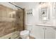 Bathroom with a shower, toilet, and vanity with storage at 7910 E Thomas Rd # 118, Scottsdale, AZ 85251