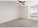 Spacious bedroom with ceiling fan and large window at 7910 E Thomas Rd # 118, Scottsdale, AZ 85251