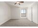 Well-lit bedroom featuring a ceiling fan and window at 7910 E Thomas Rd # 118, Scottsdale, AZ 85251