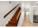 View of wooden staircase leading to the upper level at 7910 E Thomas Rd # 118, Scottsdale, AZ 85251