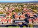 Aerial view of a community with numerous buildings and a central pool at 7920 E Arlington Rd # 2, Scottsdale, AZ 85250