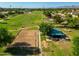 Aerial view of a park with sports fields, a volleyball court, and a shaded pavilion at 7920 E Arlington Rd # 2, Scottsdale, AZ 85250