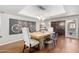 Elegant dining room with wooden table, chairs, and stylish wall art at 7920 E Arlington Rd # 2, Scottsdale, AZ 85250